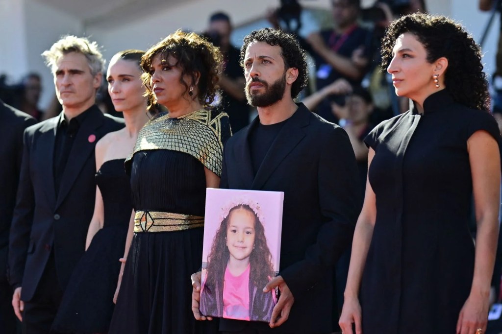 The film crew with a photo of Hind Rajab